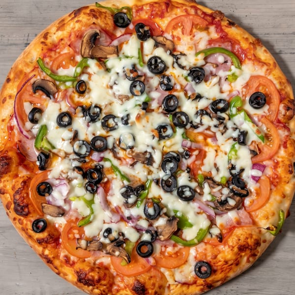 A vibrant supreme pizza with olives, mushrooms, peppers, tomatoes, onions, and melted cheese.